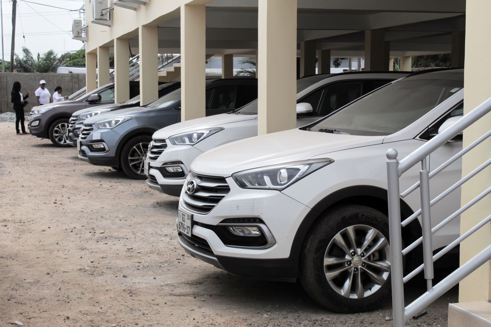 Row of PTL Hyundai SUVs parked under a building